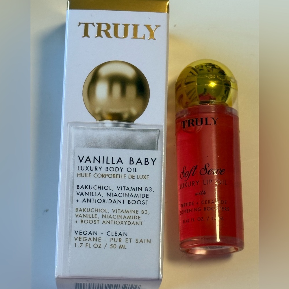 NWT-Set of 2- Truly vanilla baby body oil and luxury lip oil.